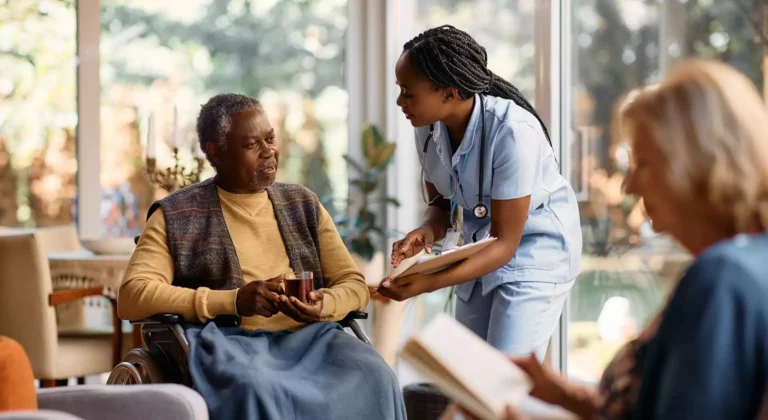a nurse talking to an old man