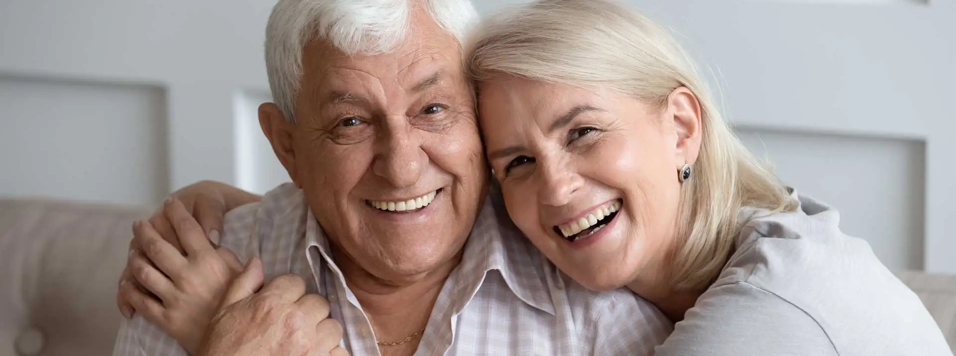 two elderly people looking happy