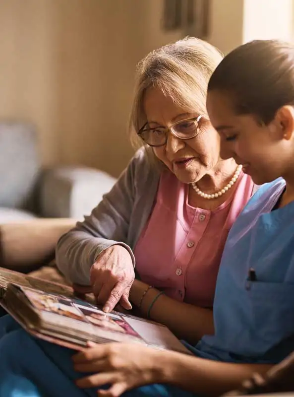 an old woman with a caregiver